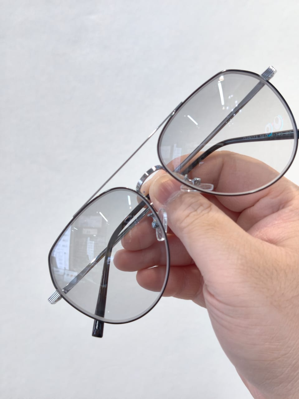 Gradient grey photochromic lenses indoors